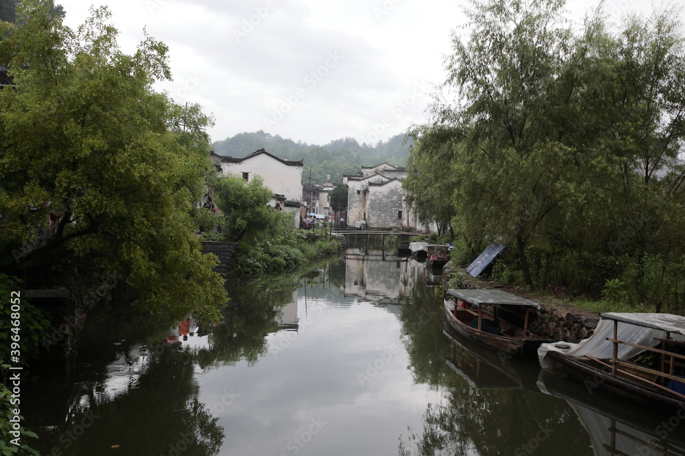 View of representative Ancient village Likeng with river and boats in Wuyuan county, Jiangxi province, China.