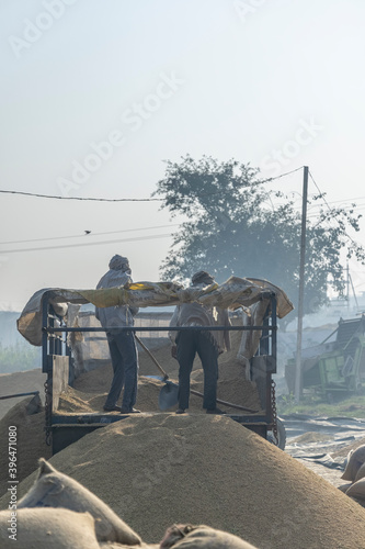 Photography food grains are being taken out from the trolley in farmers market