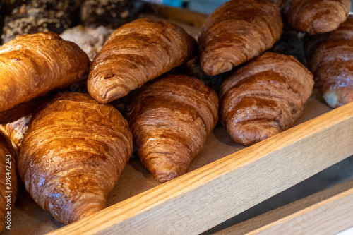 Delicious croissants on the store showcase of the bakery house