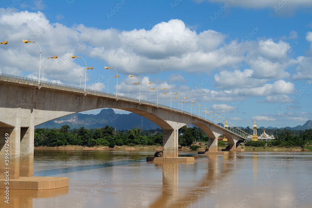 Third Thai–Lao Friendship Bridge against clear blue sky and clouds at Nakhon Phanom,Thailand. Third Thai–Lao Friendship Bridge against clear blue sky and clouds at Nakhon Phanom,Thailand.