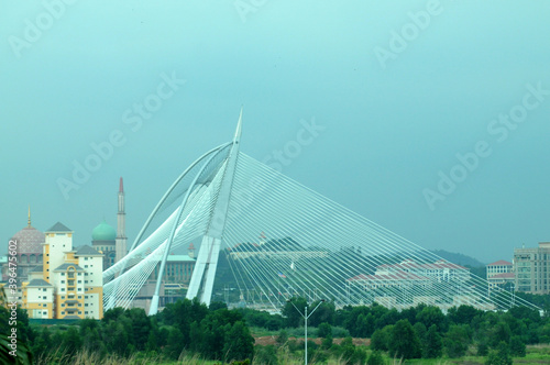 Seri Wawasan Bridge or Putra Bridge and Putrajaya Lake with blue sky photo