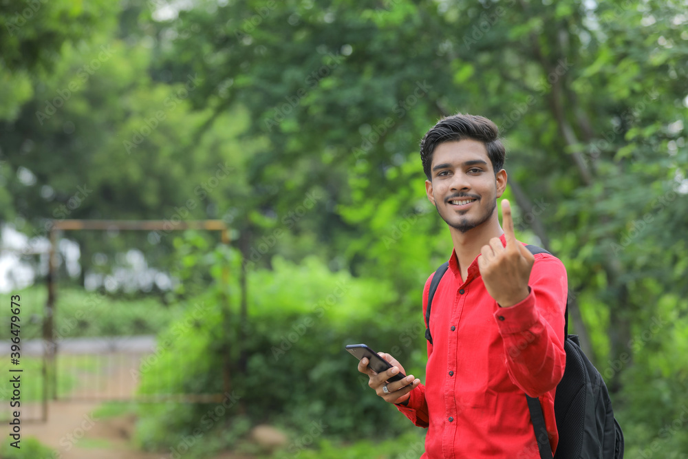 Young indian voter showing finger Young indian voter showing finger