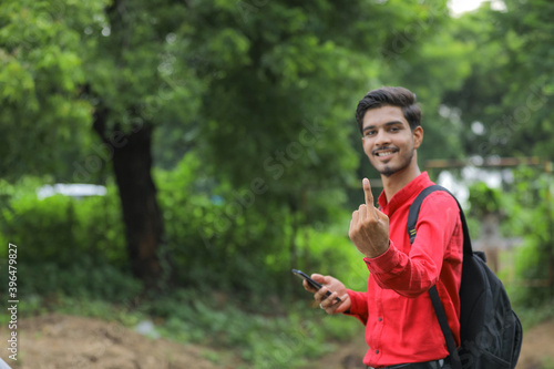 Young indian voter showing finger © PRASANNAPIX