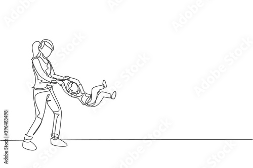 Single continuous line drawing of young mom playing with her son at home, lifting and swinging at home, parenthood. Family parenting concept. Trendy one line draw design vector illustration graphic