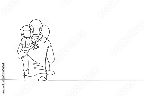 One continuous line drawing of young mother hugging her sleepy son while holding airplane toy at home, family life. Happy parenting concept. Dynamic single line draw design vector graphic illustration