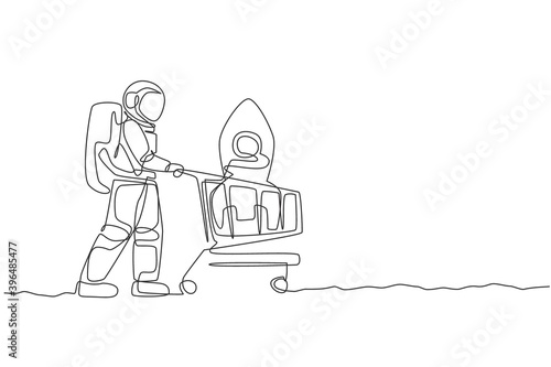 Single continuous line drawing of young astronaut pushing shopping cart in supermarket and buying rocket toy. Cosmonaut outer space concept. Trendy one line draw design graphic vector illustration