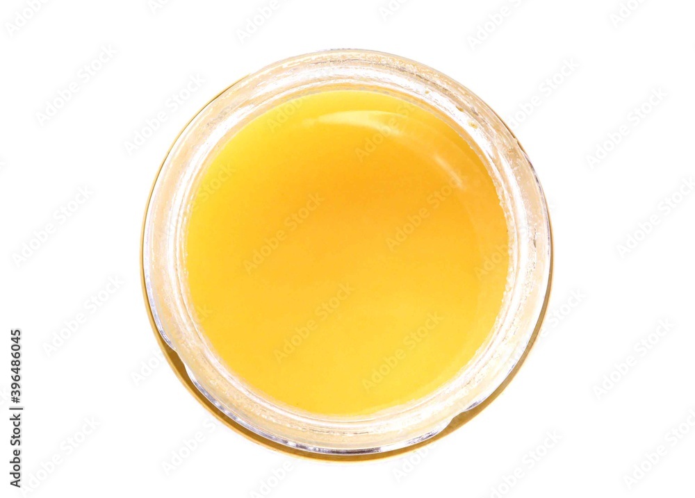 Honey on a white isolated background. Honey in a jar Honey on a white isolated background. Honey in a jar