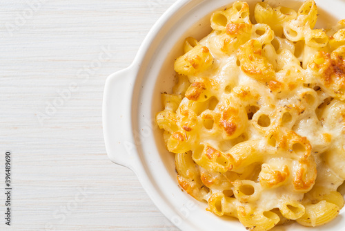 American mac and cheese, macaroni pasta in cheesy sauce photo