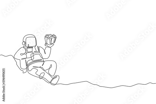 One continuous line drawing of cosmonaut laying relax on moon surface eat french fries and drinking soft soda. Fantasy outer space astronaut life concept. Single line draw design vector illustration