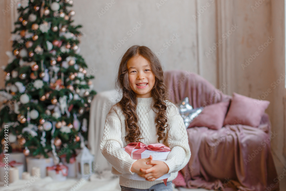 girl with christmas tree hold present girl with christmas tree hold present