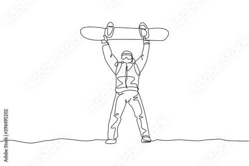 Single continuous line drawing young sportive snowboarder man lift snowboard board at mountain. Outdoor extreme sport. Winter season vacation concept. One line draw graphic design vector illustration