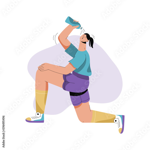 Sportswoman running marathon and drinking water