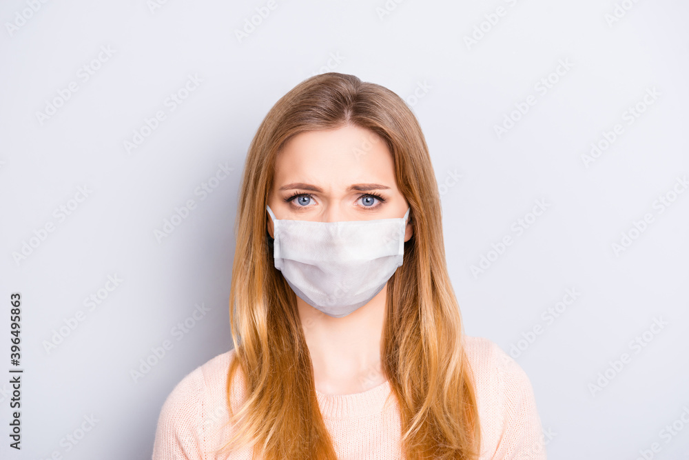 Photo of confused unsure beautiful woman wear medical respirator isolated gray color background Photo of confused unsure beautiful woman wear medical respirator isolated gray color background