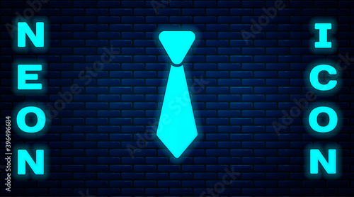 Glowing neon Tie icon isolated on brick wall background. Necktie and neckcloth symbol. Vector.