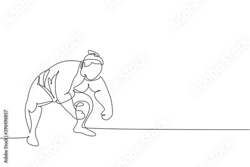 One single line drawing of young overweight Japanese sumo man ready to fight at arena competition vector illustration. Traditional rikishi combative sport concept. Modern continuous line draw design