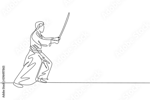 Single continuous line drawing of young sportive man wearing kimono practice aikido fighting technique with wooden sword. Japanese martial art concept. Trendy one line draw design vector illustration