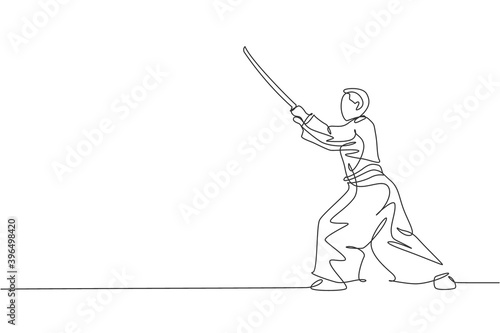 Single continuous line drawing of young sportive man wearing kimono practice aikido with wooden sword fighting technique. Japanese martial art concept. Trendy one line draw design vector illustration