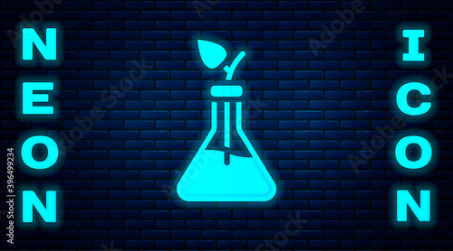Glowing neon Plant breeding icon isolated on brick wall background. Plants growing in the test tubes. Organic food ,agriculture and hydroponic. Vector.