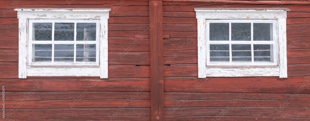 Beautiful red wooden farmhouse painted in traditional Swedish color