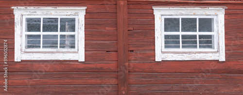 Beautiful red wooden farmhouse painted in traditional Swedish color