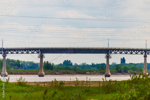 Automotive concrete and metal bridge over a river