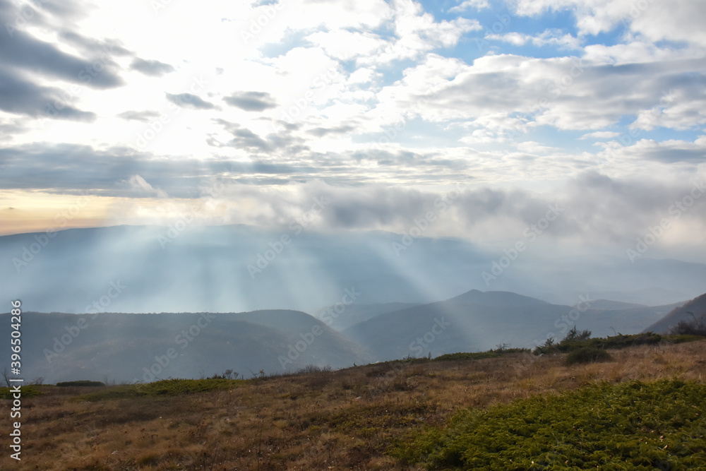 Misty foggy day in the mountain. Autumn panorama of Dry Mountain, Serbia. Clouds in mountain