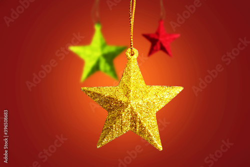 Colorful Christmas ornament hanging with a colored background