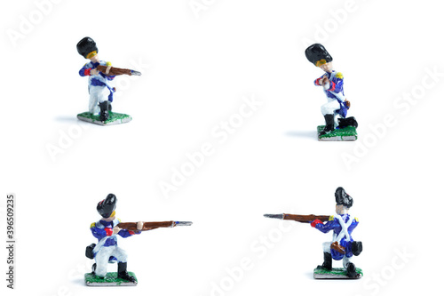 4 in 1 shot of handmade metal soldiers with musket on the white background