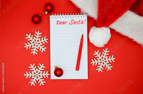 Canvas Print Wish list, an empty Christmas Notepad for writing Santa Claus, tree red glitter balls, Santa hat, snowflakes on a red background