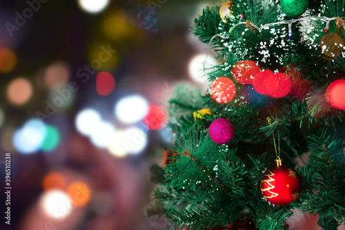 The light bulb on the Christmas tree with beautiful bokeh background