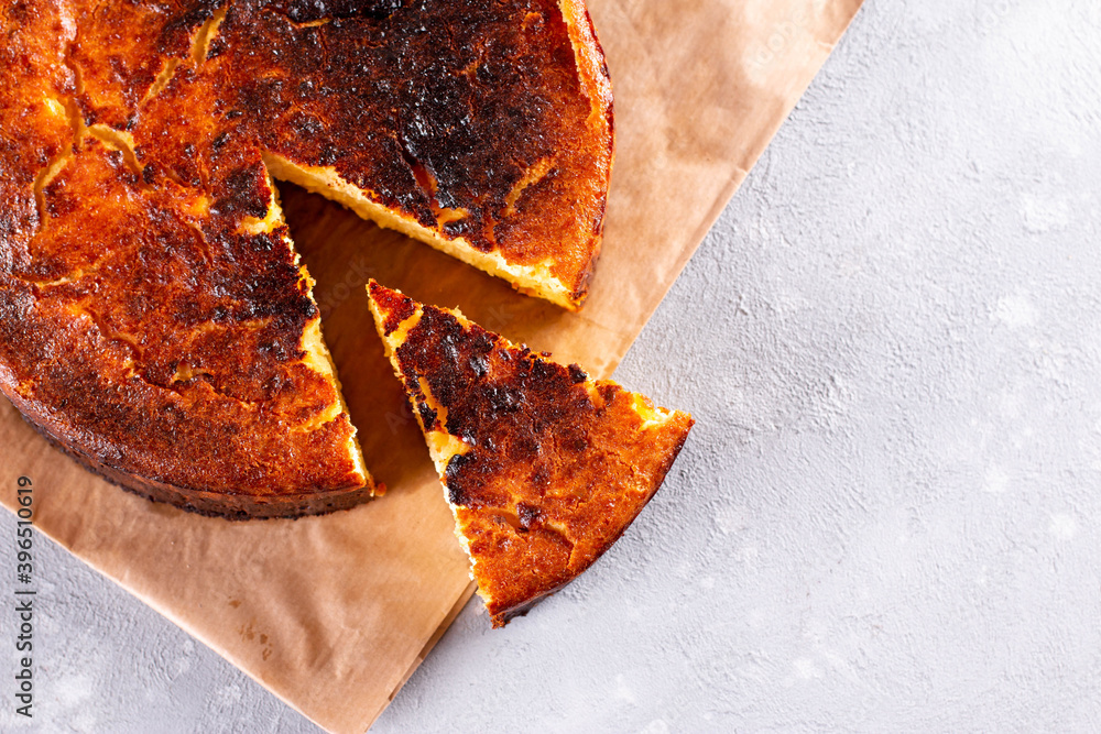 Fototapeta premium San Sebastian Basque Cheesecake. Top view. Copy space