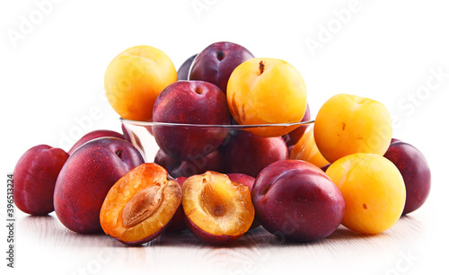 Composition with plums isolated on white background