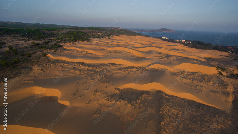 drone flight over a sand dune in mui ne while sunset in Vietnam