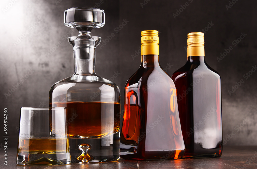 Carafe and bottles of assorted alcoholic beverages. Carafe and bottles of assorted alcoholic beverages.