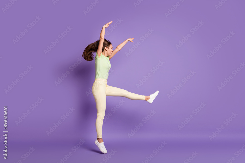 Full length body size profile side view of nice attractive cheerful cheery funky sporty girl jumping dancing professional move isolated bright vivid shine vibrant lilac violet color background Full length body size profile side view of nice attractive cheerful cheery funky sporty girl jumping dancing professional move isolated bright vivid shine vibrant lilac violet color background