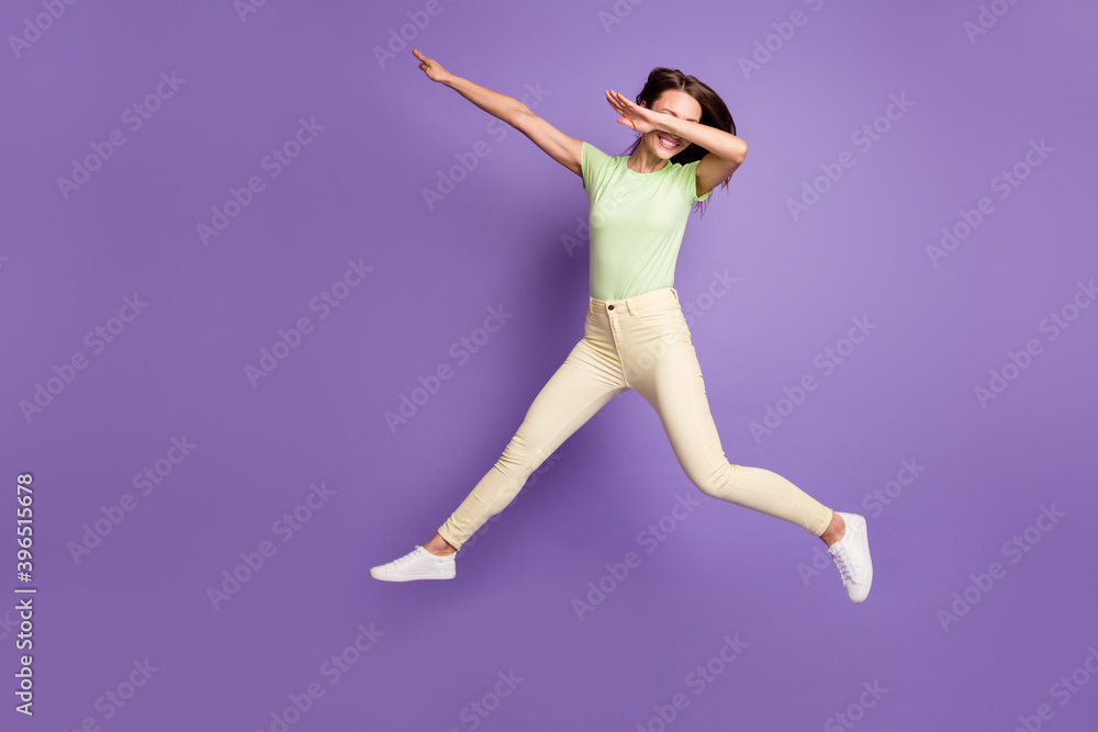 Full length body size view of her she nice attractive pretty cheerful cheery funky girlish girl jumping having fun dancing showing dab isolated bright vivid shine vibrant lilac violet color background