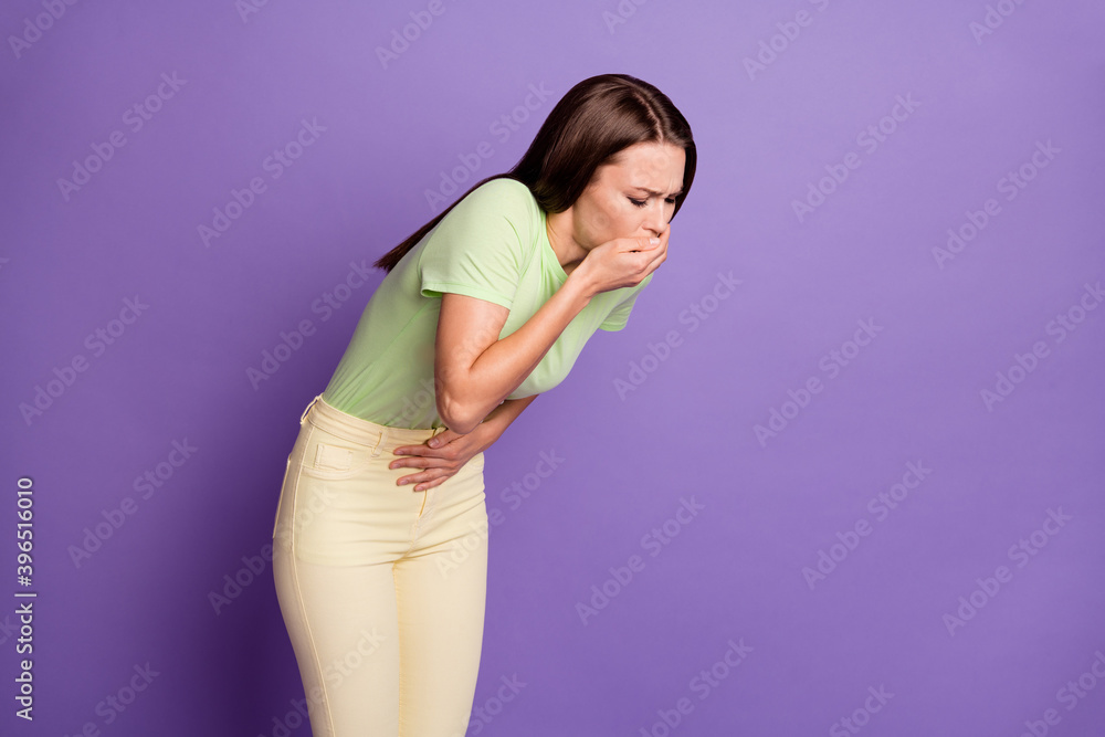 Portrait of her she nice-looking attractive sick girl touching belly abs vomiting sickness illness disease suffering isolated over bright vivid shine vibrant lilac violet color background Portrait of her she nice-looking attractive sick girl touching belly abs vomiting sickness illness disease suffering isolated over bright vivid shine vibrant lilac violet color background