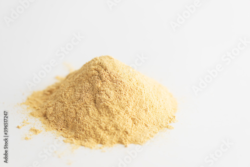 Sunflower lecithin heap on a white background. Horizontal orientation, copy space.
