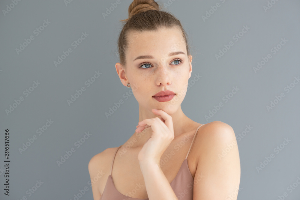 Portrait of a beautiful young woman with clean skin, beauty treatment, cosmetology and anti-aging theme Portrait of a beautiful young woman with clean skin, beauty treatment, cosmetology and anti-aging theme