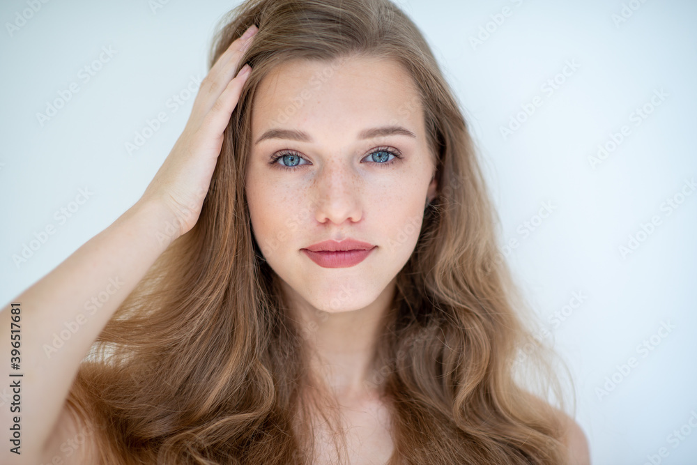 Portrait of a beautiful young woman with clean skin, beauty treatment, cosmetology and anti-aging theme Portrait of a beautiful young woman with clean skin, beauty treatment, cosmetology and anti-aging theme
