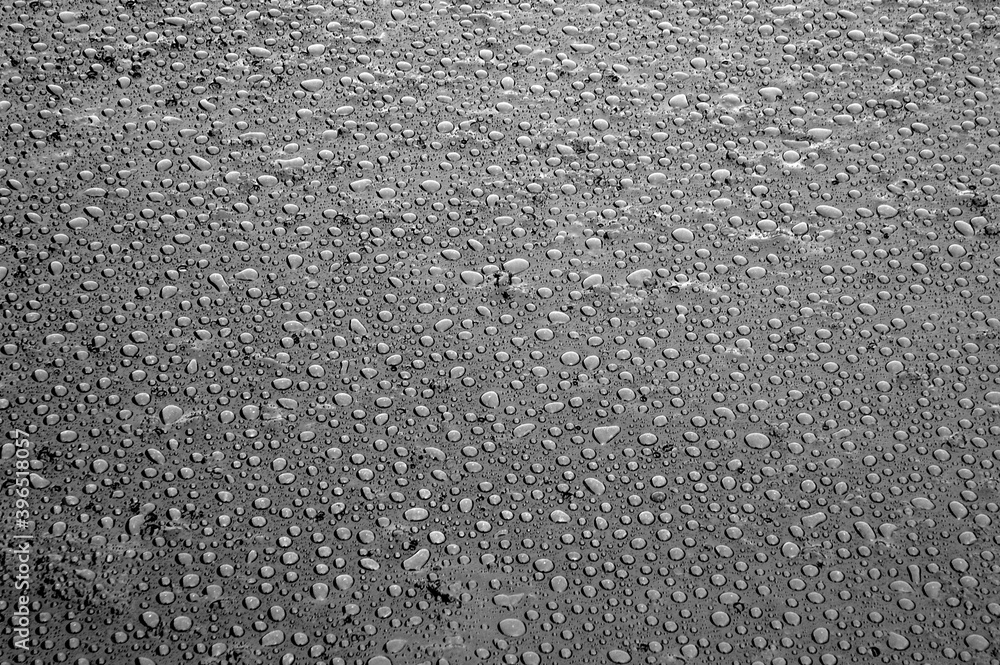 A picture of watter drops on the petroleum surface.