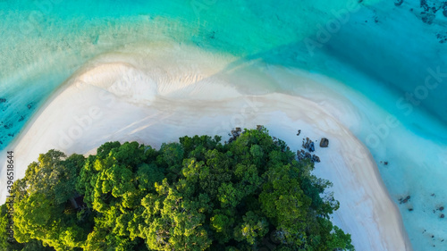 Aerial view of Amazing island with white sand beach green tree forest and blue sea water background