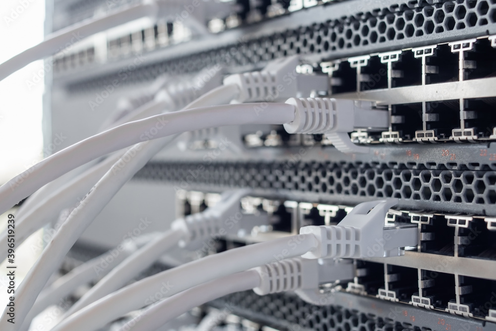 Working switches in data center with white cables Working switches in data center with white cables
