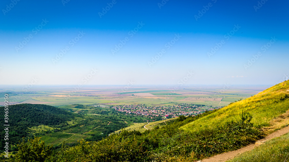 Romanian village with a large plain in the summer