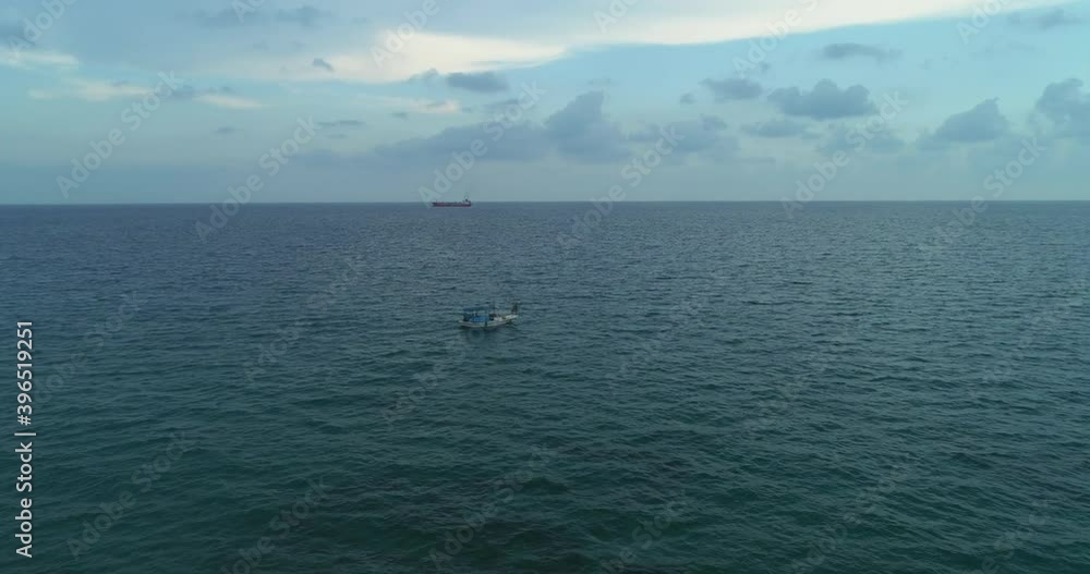 Aerial shot of the boat going in the middle of the sea. Aerial shot of the boat going in the middle of the sea.