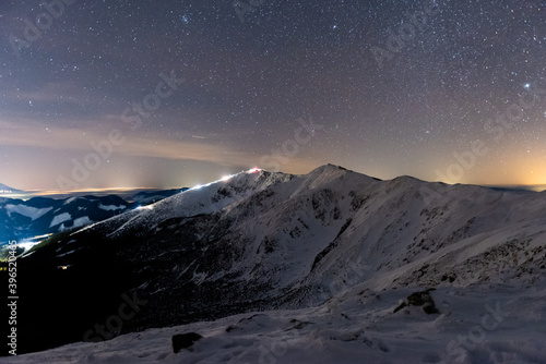 Magic starry night over the mountains in winter, Low Tatras National Park Slovakia