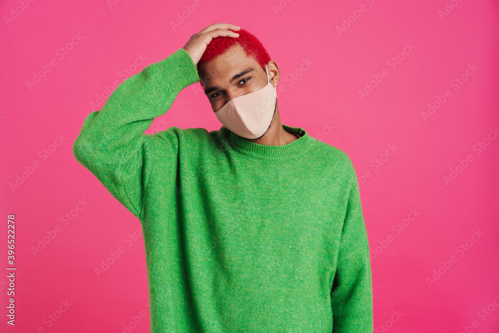 Joyful african american guy in face mask looking at camera Joyful african american guy in face mask looking at camera
