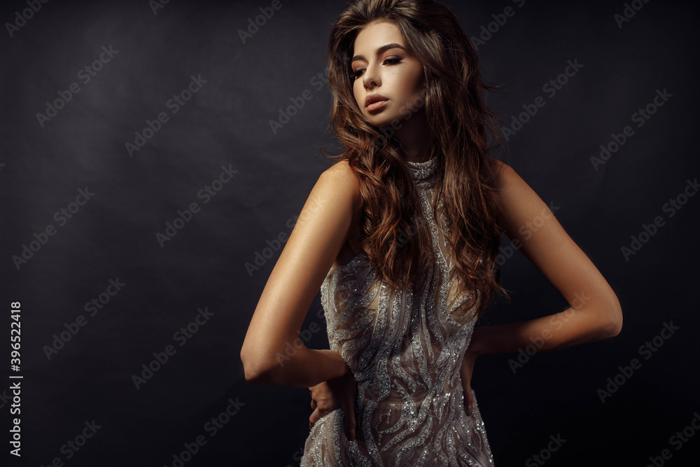 Photo portrait of pretty woman in fancy dress wavy hairstyle posing looking empty space isolated dark color studio background Photo portrait of pretty woman in fancy dress wavy hairstyle posing looking empty space isolated dark color studio background