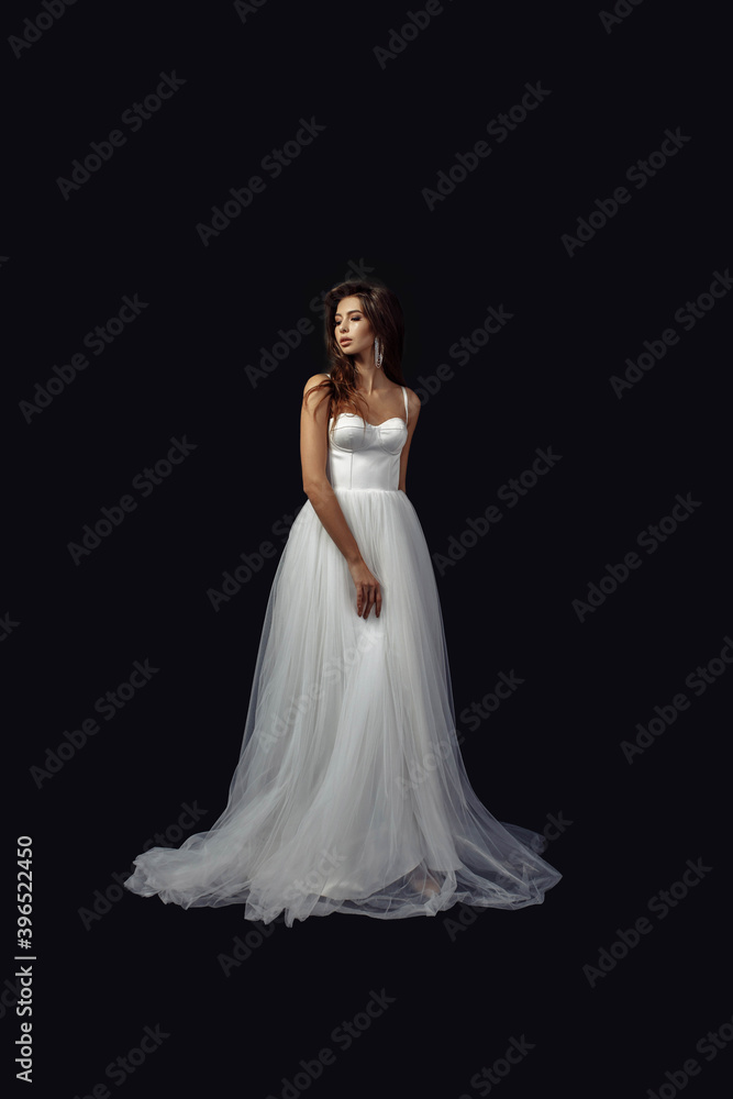 Full length body size photo of young girl in white wedding dress luxury earrings looking at side isolated on dark color studio background