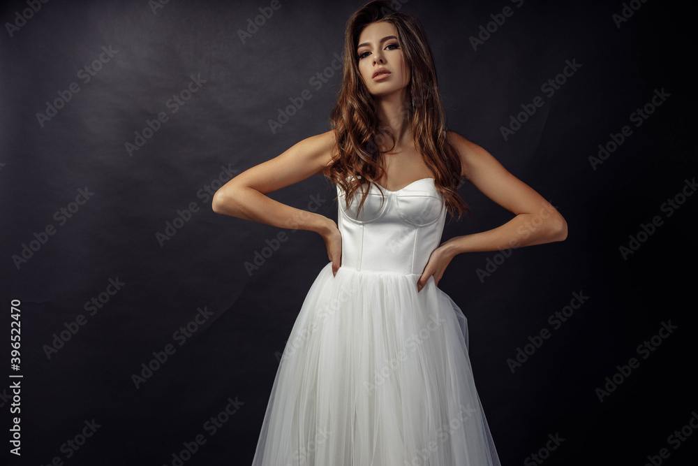 Photo portrait of pretty woman wearing  white dress fancy make-up posing isolated on dark color studio background